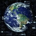 信息安全顾问苏珂在办公桌前查看多屏幕域名检测数据的工作照